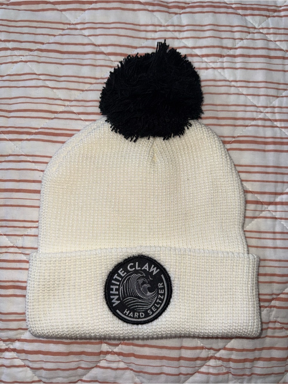 White Claw Hard Seltzer Pom Beanie Hat in Cream/Whote with Black Pom